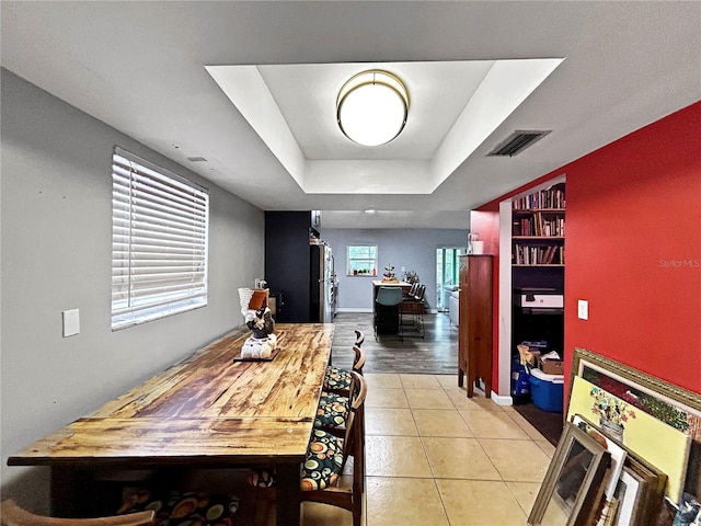 1609 Haven Bnd, Tampa, FL 33613 - dining space featuring a tray ceiling and tile patterned flooring