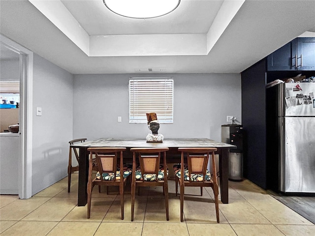 1609 Haven Bnd, Tampa, FL 33613 - dining space with a tray ceiling and light tile patterned floors
