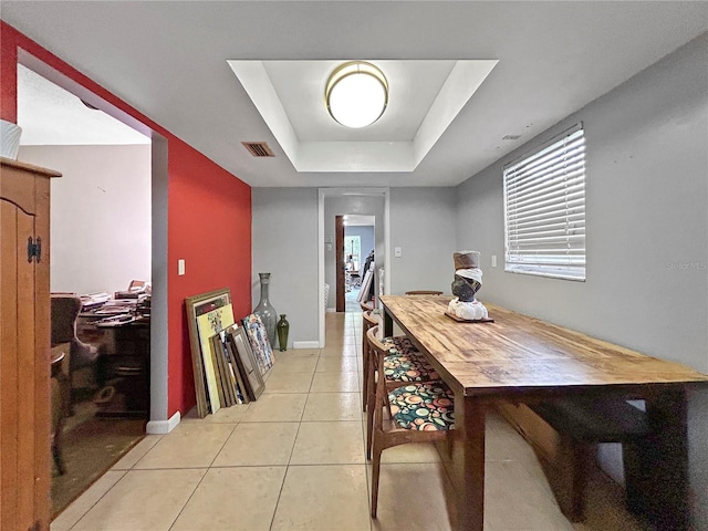 1609 Haven Bnd, Tampa, FL 33613 - dining area featuring a raised ceiling and light tile patterned flooring