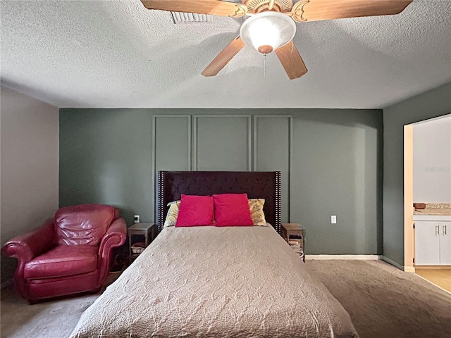 1609 Haven Bnd, Tampa, FL 33613 - bedroom featuring light colored carpet, a ceiling fan, and a textured ceiling