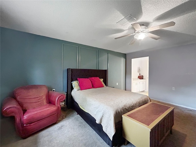 1609 Haven Bnd, Tampa, FL 33613 - bedroom with carpet, a textured ceiling, ceiling fan, and ensuite bathroom