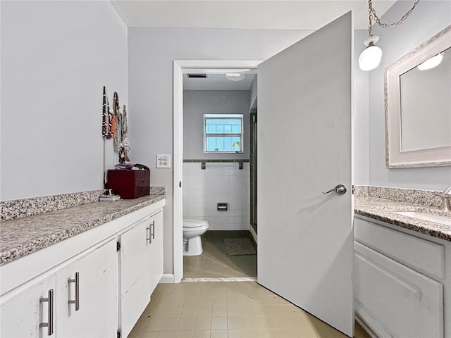 1609 Haven Bnd, Tampa, FL 33613 - bathroom with vanity, tile patterned flooring, and a shower stall
