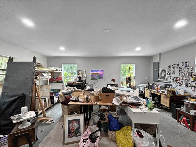 1609 Haven Bnd, Tampa, FL 33613 - home office featuring recessed lighting, plenty of natural light, concrete flooring, and electric panel