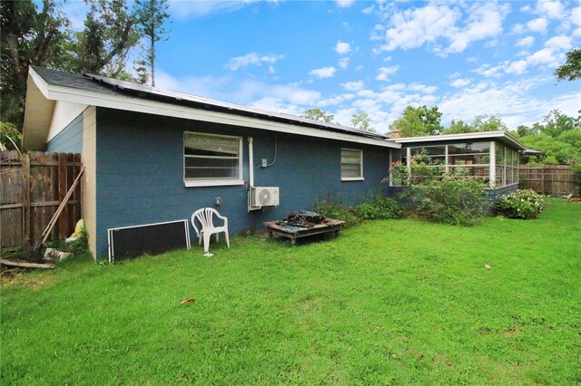 1609 Haven Bnd, Tampa, FL 33613 - rear view of property with a sunroom