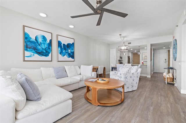 615 Dream Island Pl Unit 210, Longboat Key, FL 34228 - living area featuring ceiling fan, wood finished floors, and recessed lighting