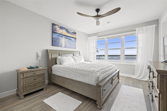 615 Dream Island Pl Unit 210, Longboat Key, FL 34228 - bedroom with light wood-style floors and ceiling fan