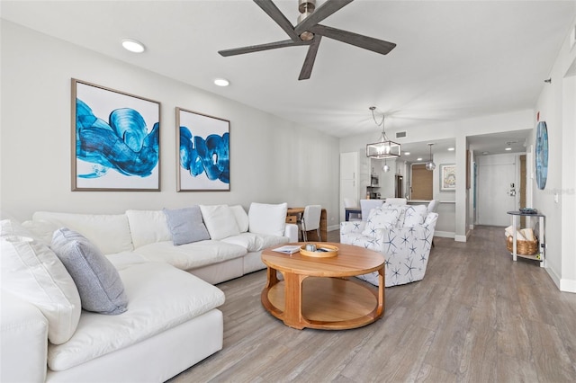 615 Dream Island Pl Unit 210, Longboat Key, FL 34228 - living room with ceiling fan, wood finished floors, and recessed lighting