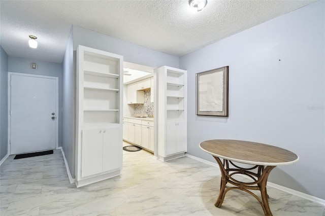 2003 Greenbriar Blvd Unit 8, Clearwater, FL 33763 - hallway featuring light marble finish flooring and a textured ceiling