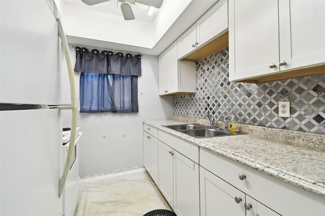 2003 Greenbriar Blvd Unit 8, Clearwater, FL 33763 - kitchen with white appliances, tasteful backsplash, a ceiling fan, light marble finish floors, and white cabinetry