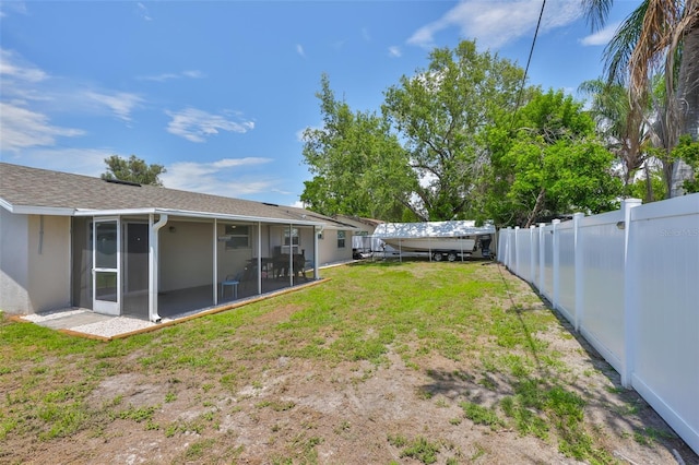 540 Firefly Ln, Apollo Beach, FL 33572 - fenced backyard featuring a sunroom