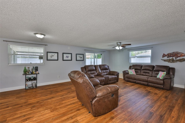 540 Firefly Ln, Apollo Beach, FL 33572 - living area with wood finished floors, a ceiling fan, and a textured ceiling