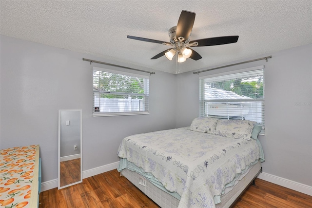 540 Firefly Ln, Apollo Beach, FL 33572 - bedroom with wood finished floors, a textured ceiling, multiple windows, and ceiling fan