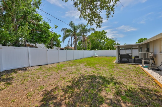 540 Firefly Ln, Apollo Beach, FL 33572 - fenced backyard featuring a sunroom