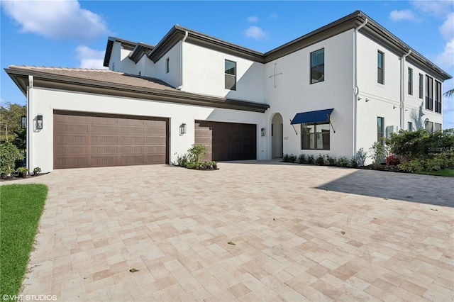 19781 Marino Lake Cir Unit 202, Miromar Lakes, FL 33913 - view of front of home with stucco siding and decorative driveway
