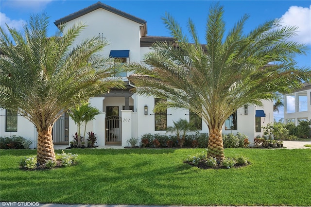 19781 Marino Lake Cir Unit 202, Miromar Lakes, FL 33913 - view of front of property with stucco siding and a front yard