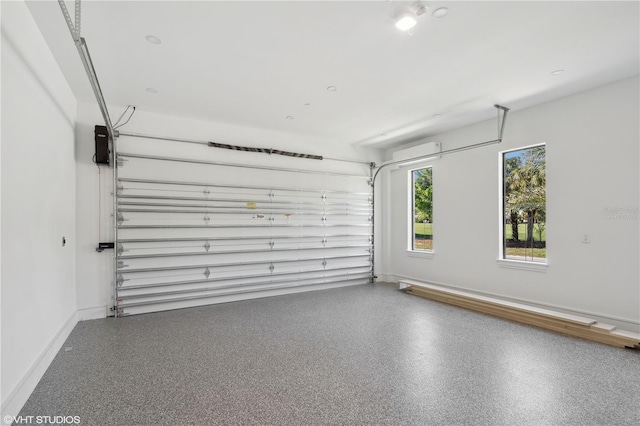 19781 Marino Lake Cir Unit 202, Miromar Lakes, FL 33913 - garage featuring baseboards