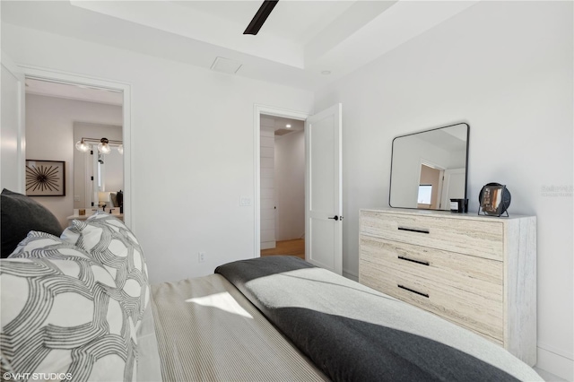19781 Marino Lake Cir Unit 202, Miromar Lakes, FL 33913 - bedroom featuring ceiling fan and a raised ceiling