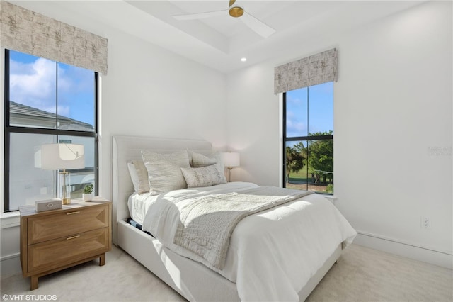 19781 Marino Lake Cir Unit 202, Miromar Lakes, FL 33913 - bedroom with light carpet, a raised ceiling, and a ceiling fan