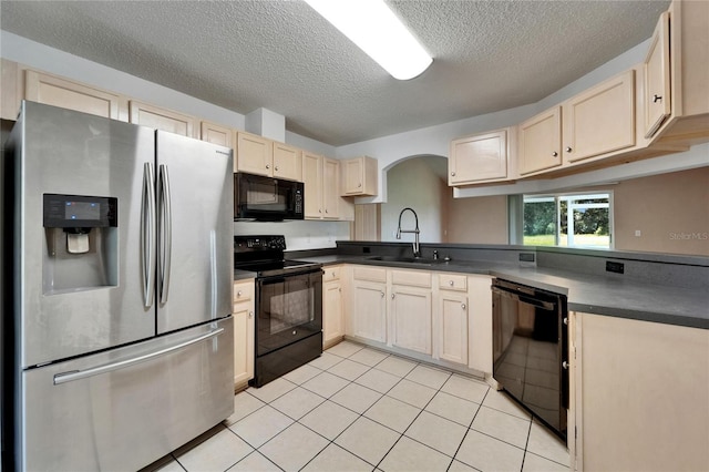 2719 Wilder Trace Ct, Plant City, FL 33566 - kitchen featuring black appliances, light brown cabinets, a textured ceiling, arched walkways, and light tile patterned floors