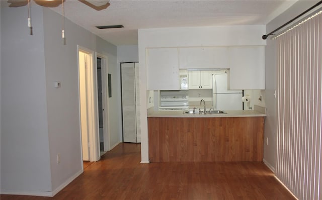 8220 12th Way N Unit H, Saint Petersburg, FL 33702 - kitchen with white appliances, wood finished floors, ceiling fan, and light countertops