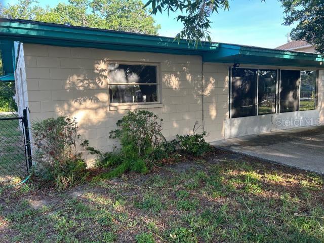 3901 N Nokomis Pt, Crystal River, FL 34428 - view of home's exterior featuring concrete block siding and a patio area