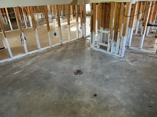 3901 N Nokomis Pt, Crystal River, FL 34428 - miscellaneous room featuring unfinished concrete floors