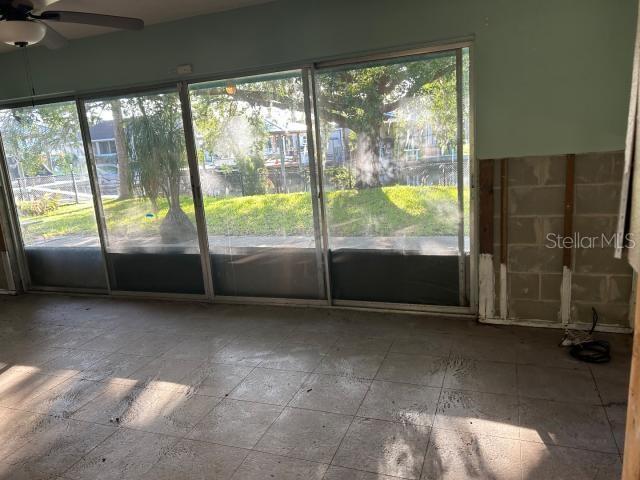 3901 N Nokomis Pt, Crystal River, FL 34428 - unfurnished sunroom featuring a ceiling fan and plenty of natural light