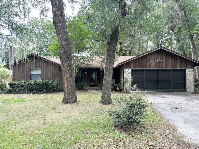 6262 E Rector St, Inverness, FL 34452 - view of front of house with driveway, an attached garage, and a front lawn