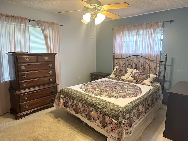 6262 E Rector St, Inverness, FL 34452 - bedroom featuring light colored carpet, ceiling fan, and a textured ceiling