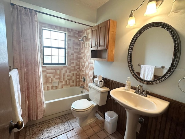 6262 E Rector St, Inverness, FL 34452 - bathroom with shower / tub combo, tile patterned flooring, and wainscoting