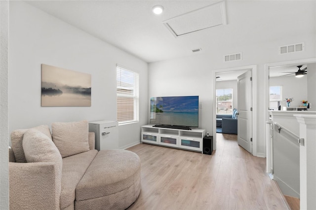 10823 Trailing Vine Dr, Tampa, FL 33610 - living room featuring attic access and light wood finished floors