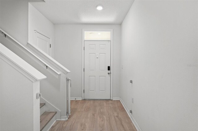10823 Trailing Vine Dr, Tampa, FL 33610 - foyer entrance with light wood-style floors and stairs