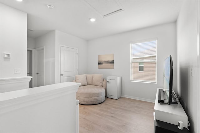 10823 Trailing Vine Dr, Tampa, FL 33610 - sitting room featuring light wood-style flooring, recessed lighting, and attic access