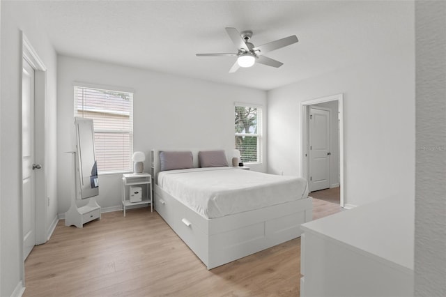 10823 Trailing Vine Dr, Tampa, FL 33610 - bedroom with light wood-type flooring and ceiling fan