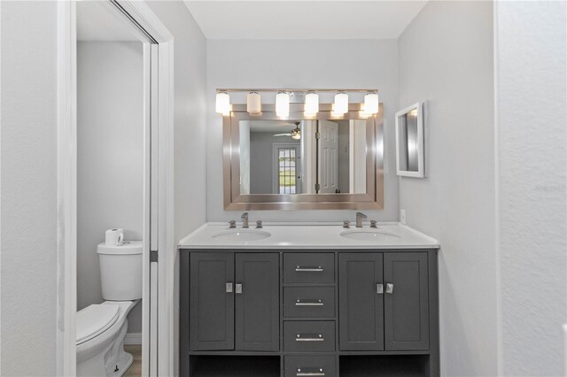 7322 Ellis Ln, Port Charlotte, FL 33981 - full bathroom with double vanity and a ceiling fan