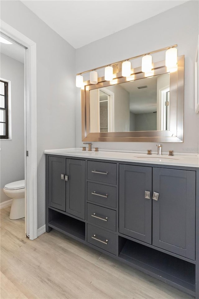 7322 Ellis Ln, Port Charlotte, FL 33981 - full bath with wood finished floors and double vanity