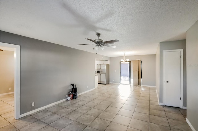 310 SW 76th Ter, North Lauderdale, FL 33068 - empty room featuring a ceiling fan, a chandelier, a textured ceiling, and light tile patterned floors