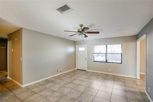 310 SW 76th Ter, North Lauderdale, FL 33068 - empty room with a ceiling fan, a textured ceiling, and light tile patterned flooring