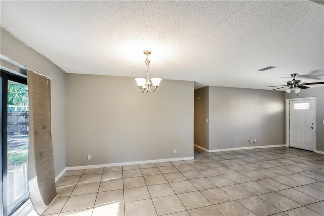 310 SW 76th Ter, North Lauderdale, FL 33068 - spare room with a textured ceiling, a chandelier, a ceiling fan, and light tile patterned floors