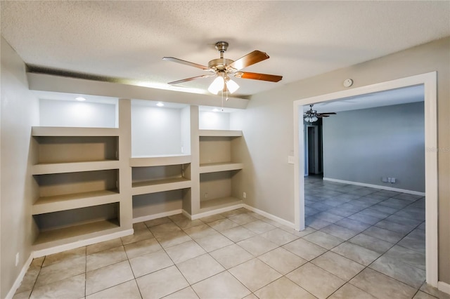 310 SW 76th Ter, North Lauderdale, FL 33068 - empty room featuring a ceiling fan, built in features, a textured ceiling, light tile patterned floors, and a smoke detector