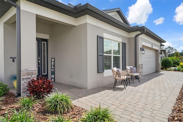 20108 Stone Pine Cir, Lutz, FL 33558 - view of patio / terrace featuring a garage and driveway