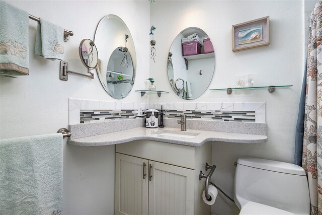 505 67th Ave Unit 11, St Pete Beach, FL 33706 - bathroom featuring decorative backsplash and vanity