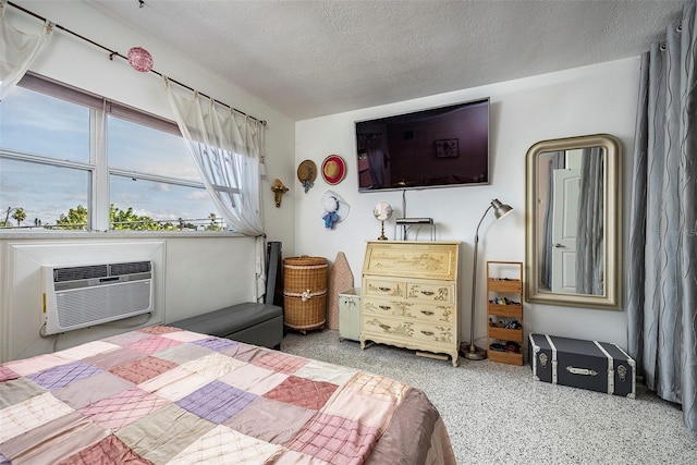 505 67th Ave Unit 11, St Pete Beach, FL 33706 - bedroom with a textured ceiling and speckled floor