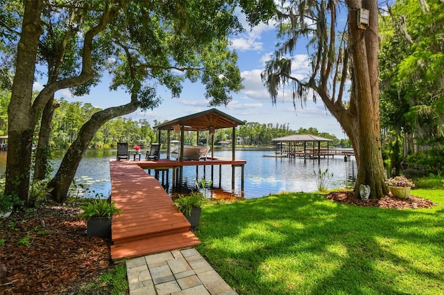 16205 Sentry Woods Ct, Odessa, FL 33556 - dock area featuring boat lift, a lawn, and a water view