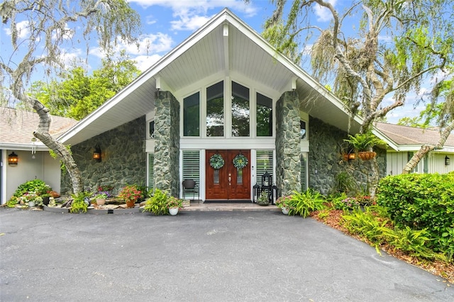 16205 Sentry Woods Ct, Odessa, FL 33556 - view of front facade featuring stone siding and french doors