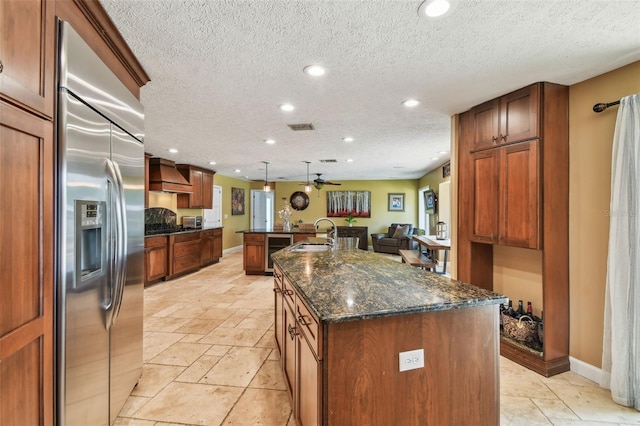 16205 Sentry Woods Ct, Odessa, FL 33556 - kitchen with stainless steel built in fridge, custom exhaust hood, a kitchen island with sink, wine cooler, and open floor plan