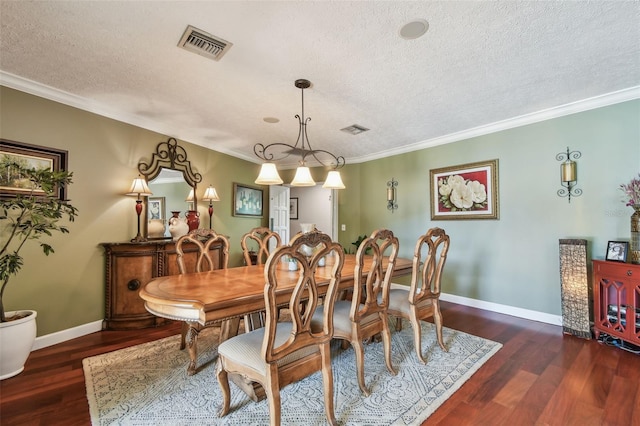 16205 Sentry Woods Ct, Odessa, FL 33556 - dining space with a textured ceiling, wood finished floors, and ornamental molding