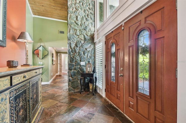 16205 Sentry Woods Ct, Odessa, FL 33556 - foyer featuring stone tile floors, a towering ceiling, and crown molding