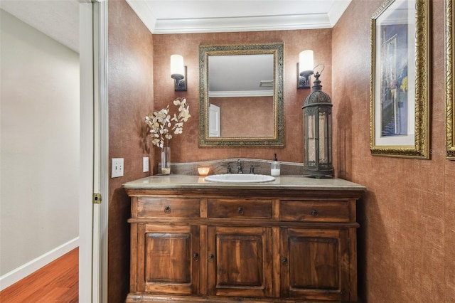 16205 Sentry Woods Ct, Odessa, FL 33556 - bathroom featuring vanity, wood finished floors, and crown molding