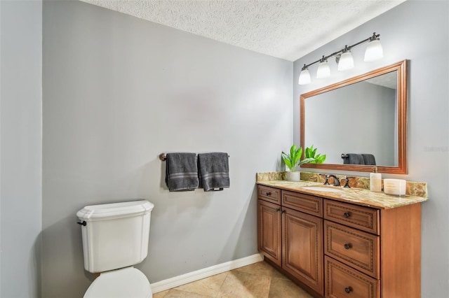 16205 Sentry Woods Ct, Odessa, FL 33556 - bathroom with vanity, a textured ceiling, and tile patterned flooring